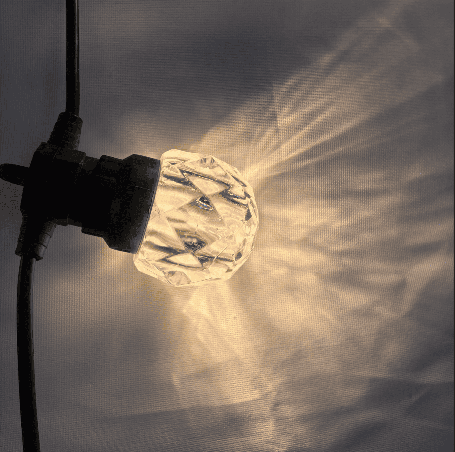 IP67 Waterproof Landscape LED String Light Plastic Bulb Close-Up IP67 waterproof landscape LED string light plastic bulb close-up showing warm decorative lighting effect for outdoor garden patio lighting
