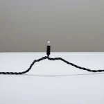 Close-up of black cable mini LED fairy light for outdoor decoration