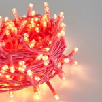 Close-up of pink PVC LED string lights with warm white lamp beads