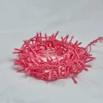 Unlit pink PVC wire light chain coil showing flexible cable and LED bead structure