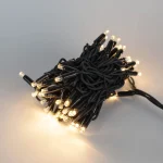 Bundled warm white LED tree wrap string lights with black wire for project decoration