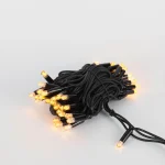 Amber LED string lights with black wire for festive and landscape decorative lighting