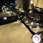 warm white wide-angle LED string lights on dark PVC cable